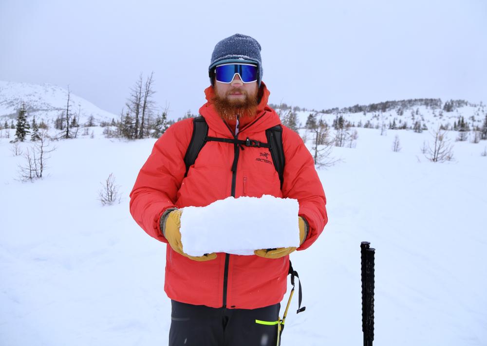 BG Holding a block of snow